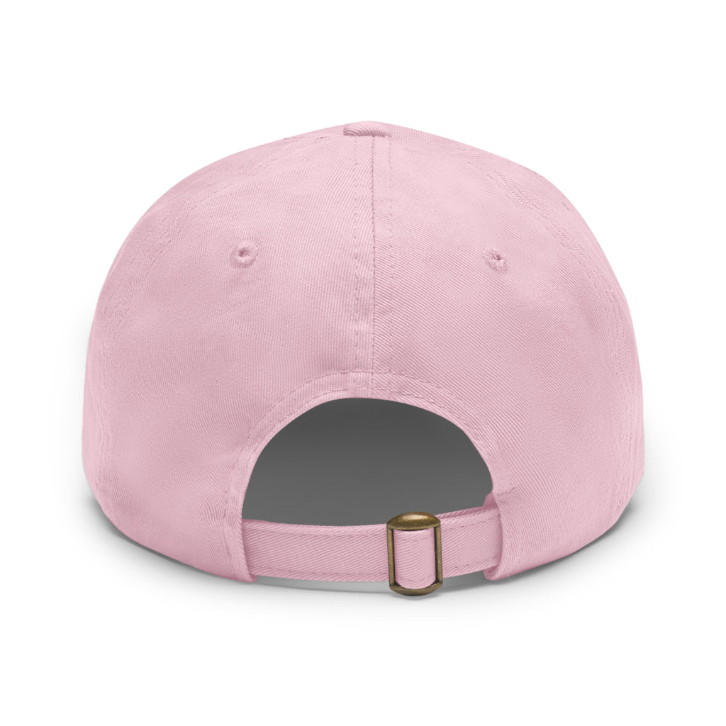 Pink twill hat with "Find Your Joy" design on a leather-like patch.
